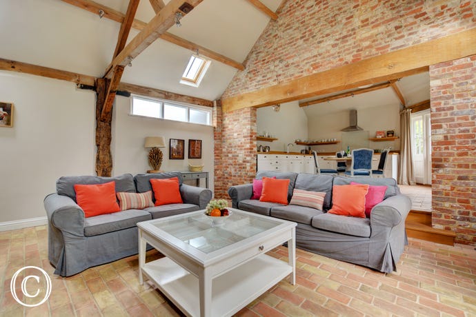 Open Plan Living Room with exposed beams and brickwork